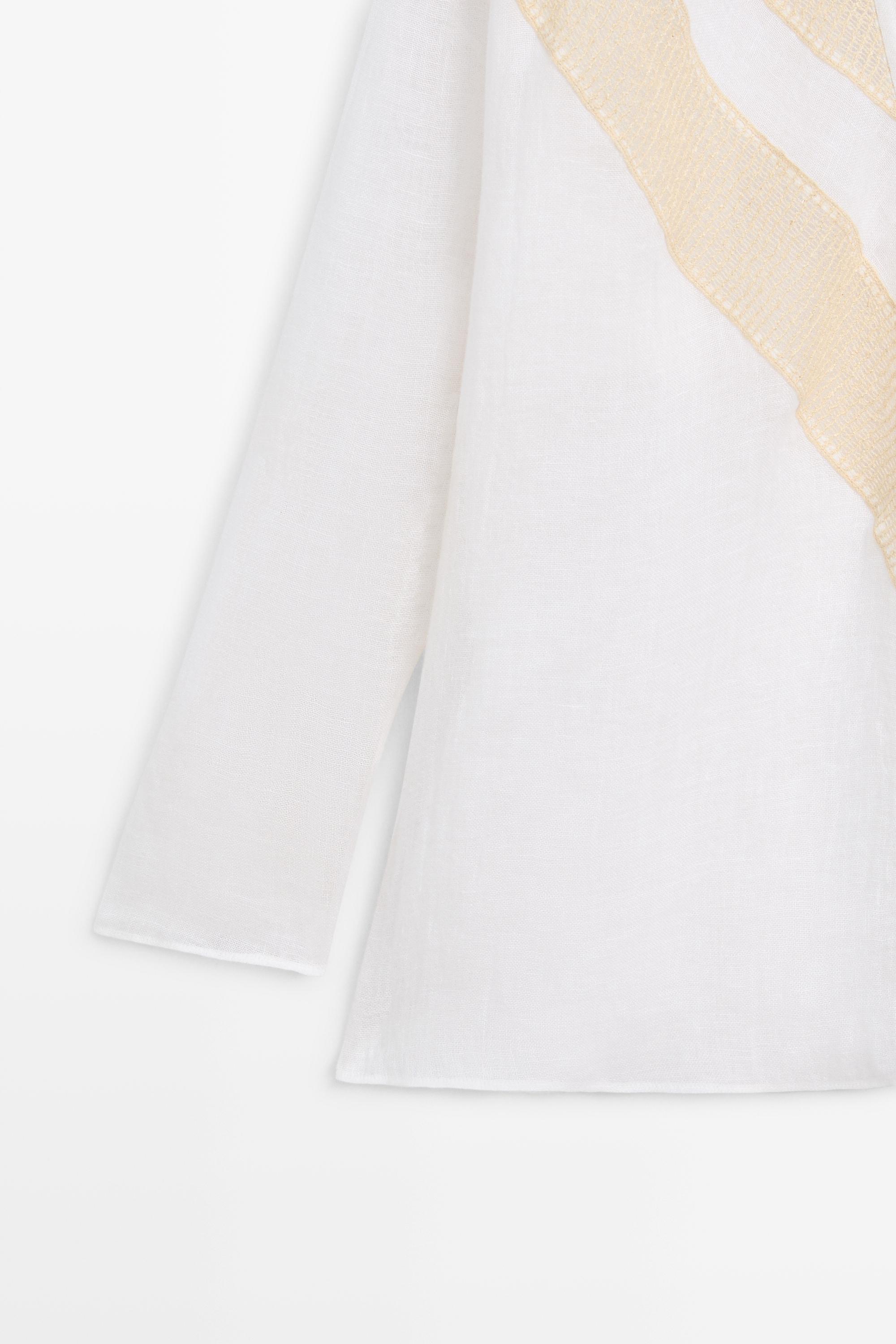 Flowing linen blend shirt with appliqué detail
